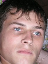 Blue-eyed beauty shows his cock while laying peacefully