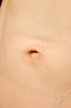 Nudist blond-haired twink posing on all fours