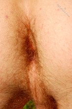 Nudist blond-haired twink posing on all fours