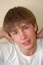 Blond-haired boy takes his shirt off and looks sexy