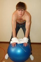 Blond-haired boy takes his shirt off and looks sexy