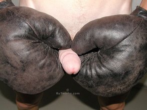 Boxer dude stroking his cock with these sexy gloves