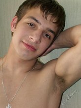 Dark-haired twink shows his tiny cock on camera