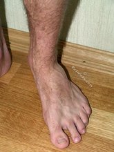 Dark-haired twink shows his tiny cock on camera