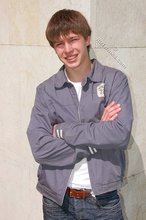 Playful twink posing outdoors and stripping indoors