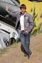 Playful twink posing outdoors and stripping indoors