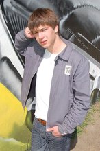 Playful twink posing outdoors and stripping indoors