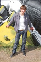 Playful twink posing outdoors and stripping indoors