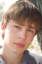 Playful twink posing outdoors and stripping indoors