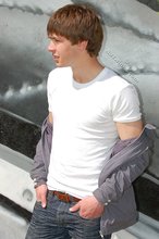 Playful twink posing outdoors and stripping indoors