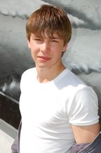 Playful twink posing outdoors and stripping indoors
