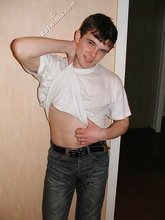 Tatted-up twink shows off in front of a camera