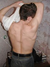 Tatted-up twink shows off in front of a camera