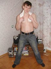 Tatted-up twink shows off in front of a camera