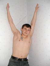 Tatted-up twink shows off in front of a camera