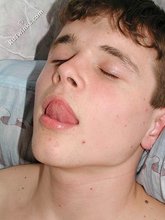 Dark-haired twink licking his own armpits on cam