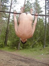 Gymnast twink showing his strength and his asshole