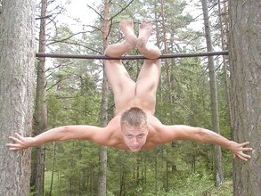 Gymnast twink showing his strength and his asshole