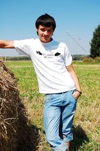 Dark-haired young twink posing in a haystack