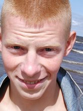 Redheaded seductive twink shows off his cock