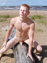 Redheaded seductive twink shows off his cock
