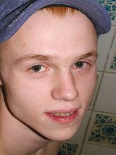 Blond-haired twink showering and showing off