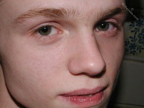 Blond-haired twink showering and showing off