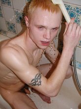 Blond-haired twink showering and showing off