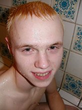Blond-haired twink showering and showing off