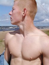 Jacked-up twink in a denim jacket shows his hot ass