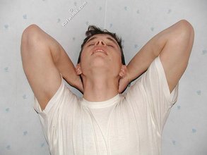 Dark-haired twink shows his feet, his socks, his smile