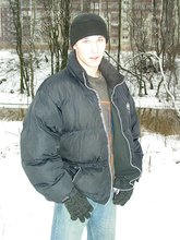 Dark-haired young Russian twink posing outdoors