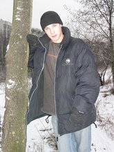 Dark-haired young Russian twink posing outdoors