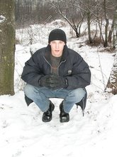 Dark-haired young Russian twink posing outdoors