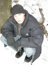 Dark-haired young Russian twink posing outdoors