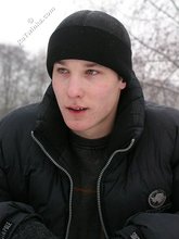 Dark-haired young Russian twink posing outdoors