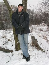 Dark-haired young Russian twink posing outdoors
