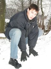 Dark-haired young Russian twink posing outdoors