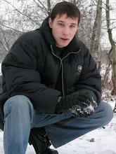 Dark-haired young Russian twink posing outdoors