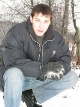 Dark-haired young Russian twink posing outdoors