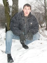 Dark-haired young Russian twink posing outdoors