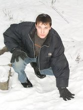 Dark-haired young Russian twink posing outdoors