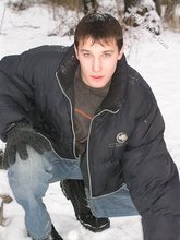 Dark-haired young Russian twink posing outdoors