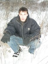 Dark-haired young Russian twink posing outdoors