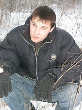 Dark-haired young Russian twink posing outdoors