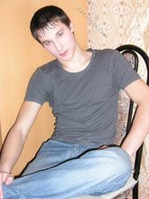 Dark-haired young Russian twink posing outdoors