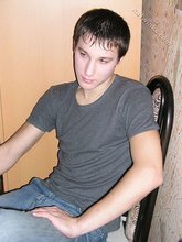 Dark-haired young Russian twink posing outdoors