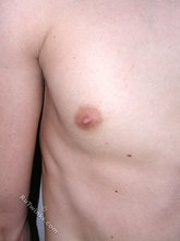 Dark-haired young boy flashes his delicious ass up close