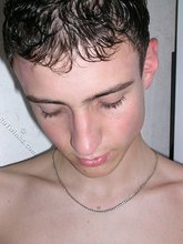 Dark-haired young boy flashes his delicious ass up close