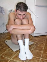 White socks hottie showing off his soles for you